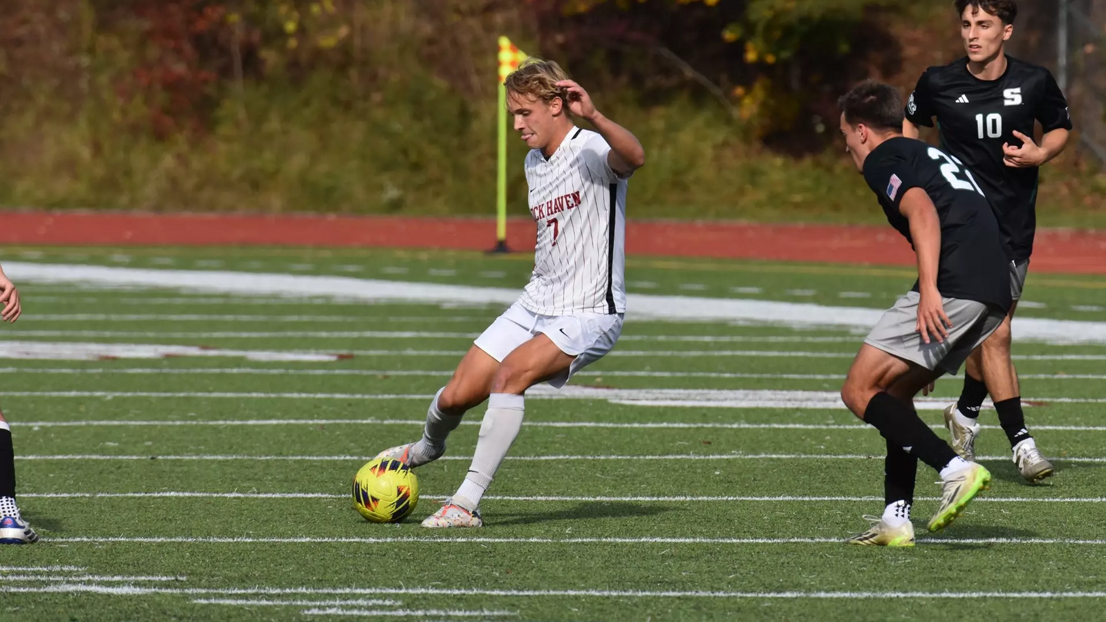 Kade Black strikes the ball against Slippery Rock